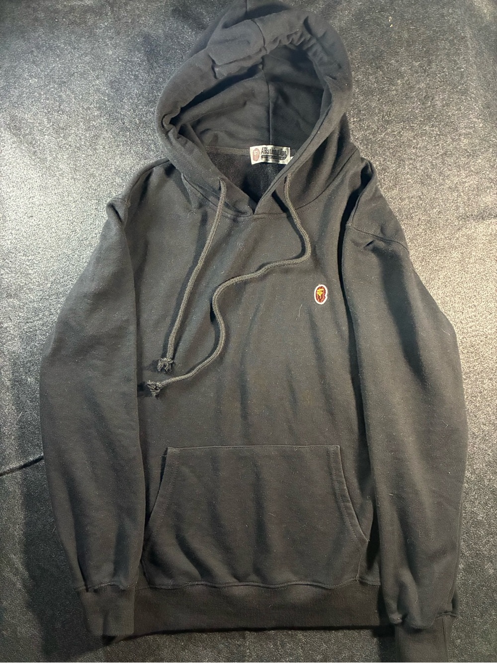 Black Hooded Pullover Sweatshirt with Small Embroidered Crest